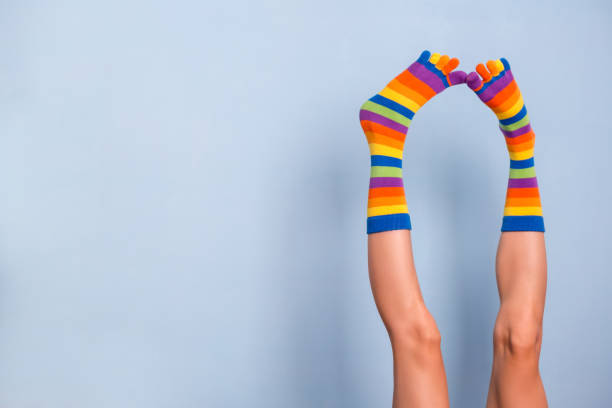 istock Legs in funny socks 1194681684