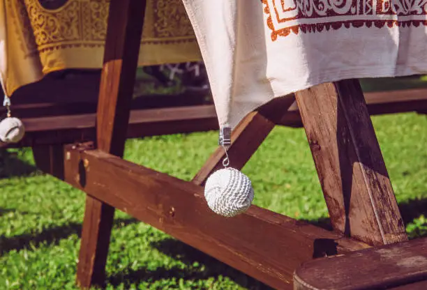 Photo of Clip tablecloth weights attached to a table cloth outdoors these are designed to hold your table cloth steady on windy day when you want to eat outside.