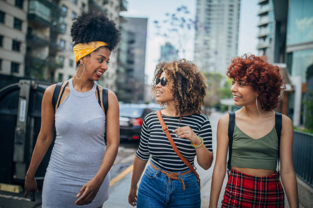 istock Three young women walking outdoors 1194681849