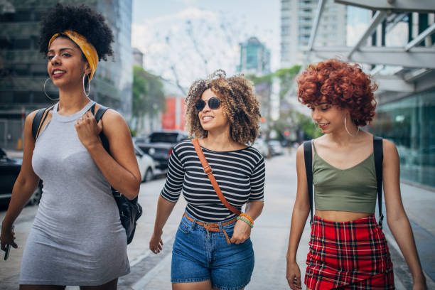 istock Three young women walking outdoors 1194682026