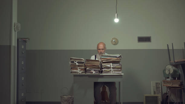 istock Frustrated businessman overloaded with paperwork 1194682472