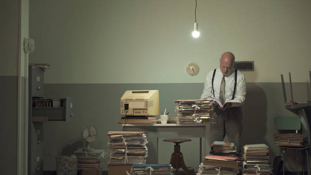 istock Businessman working in a messy office 1194683682