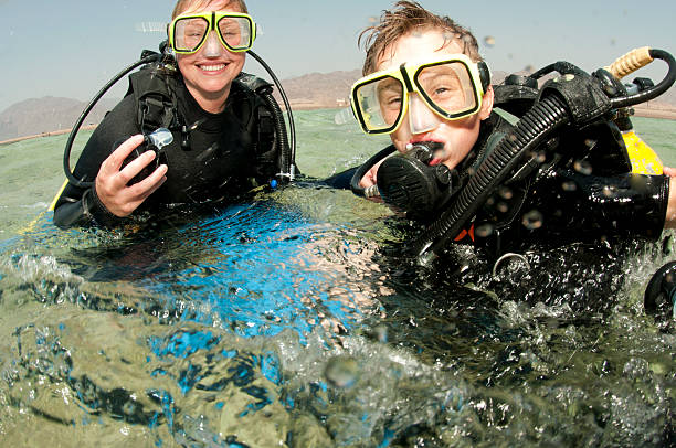 istock mother and son scuba dive 119468875