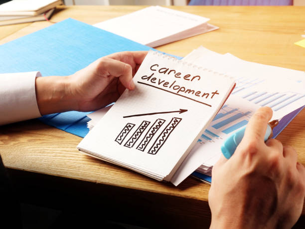 istock Man written career development sign by hand. 1194689063