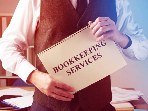 Bookkeeping services sign and accountant in the office. Bookkeeping services sign and accountant in the office. bookkeeping service stock pictures, royalty-free photos & images