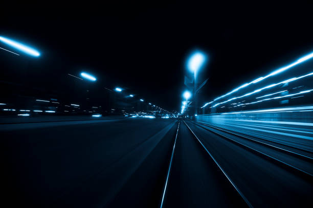istock Abstract long exposure and blurred city lights 1194689112