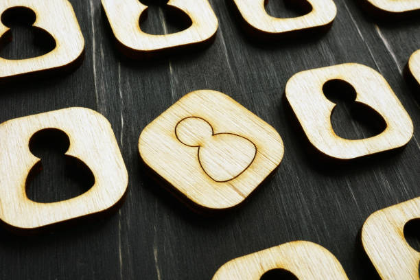 istock Unique concept. Different wooden figure in the crowd. 1194689230