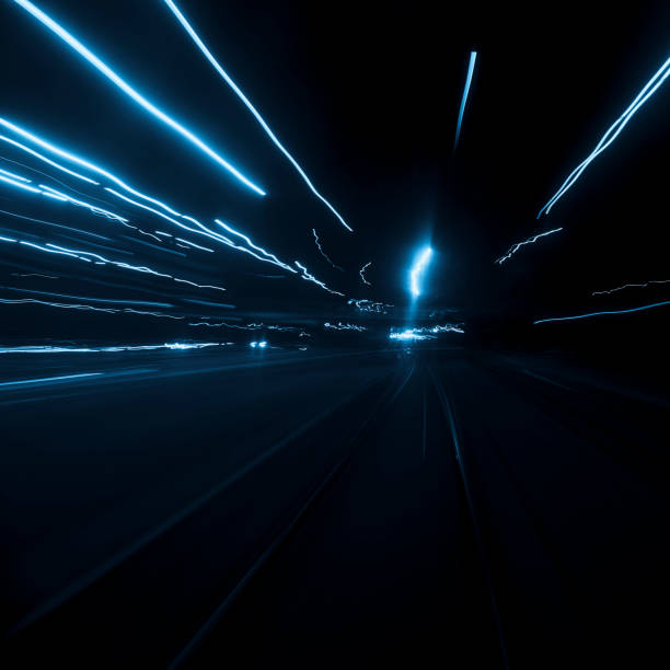 istock Abstract long exposure and blurred city lights 1194690979
