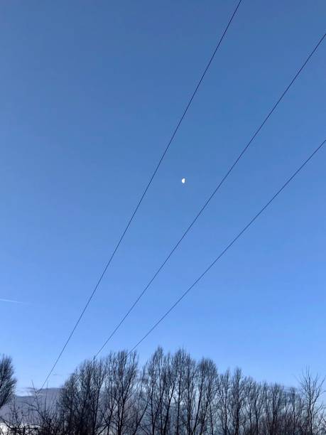 istock Moon and the telephone wire 1194691695