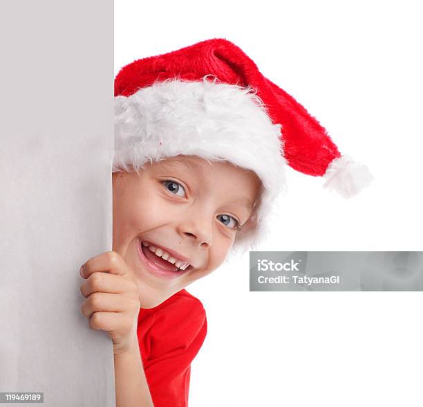 Photo libre de droit de Enfant Dans Un Chapeau De Noël banque d'images et plus d'images libres de droit de Adulte - Adulte, Banderole - Signalisation, Blanc