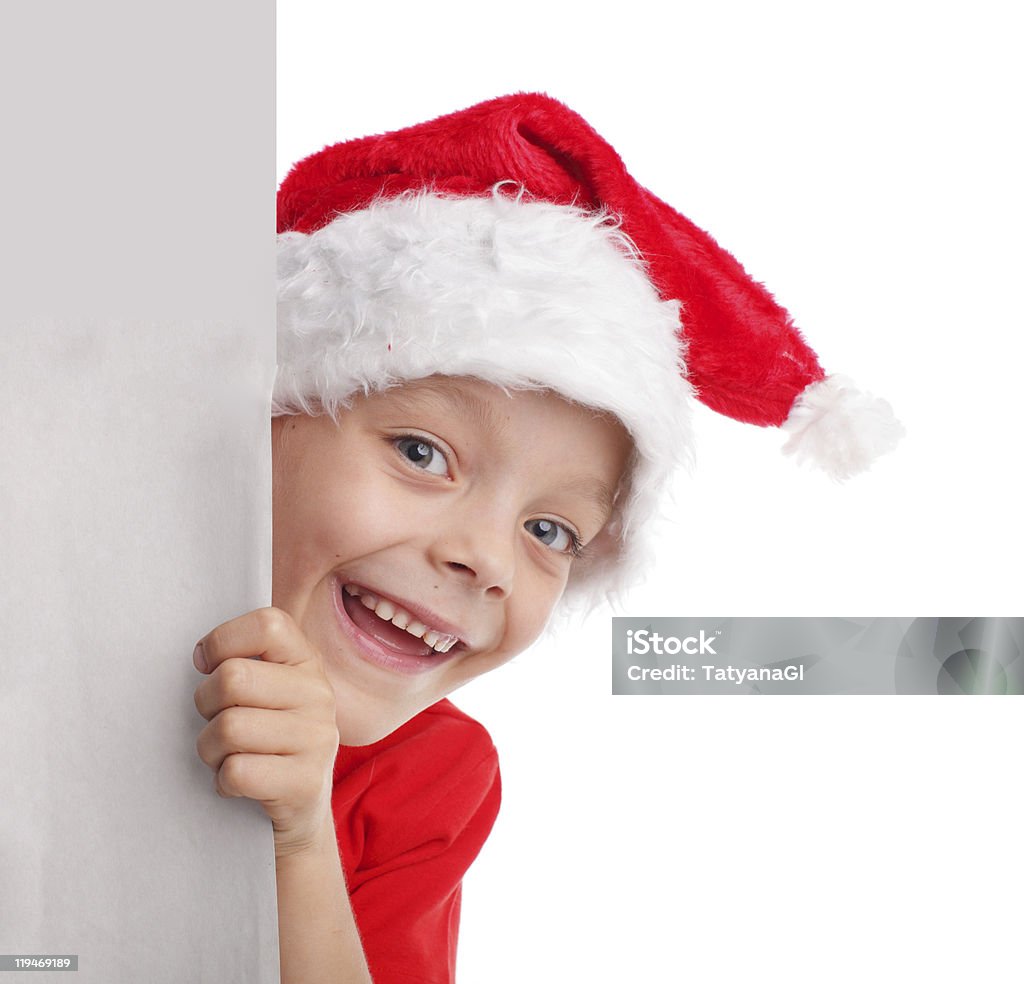 Criança em um chapéu de Natal - Foto de stock de Adulto royalty-free