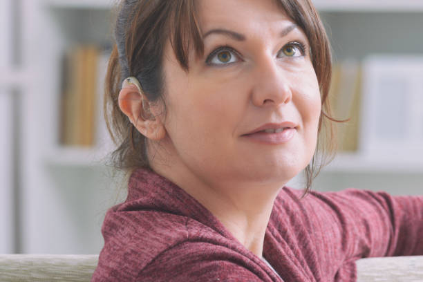 istock Deaf woman wearing hearing aid 1194693612