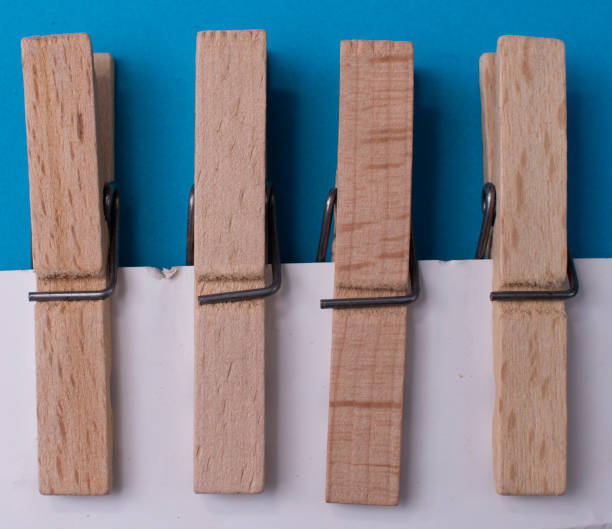 istock Four Wooden Clothespins 1194694273