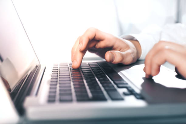 istock busienssman hands pushing keys 1194696662