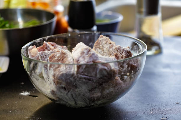 Floured raw meat stock photo