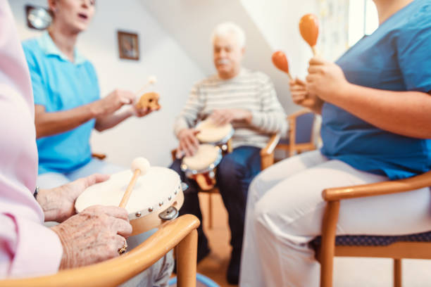 Seniors in nursing home making music with rhythm instruments Seniors in nursing home making music with rhythm instruments as musical therapy music therapy healthcare stock pictures, royalty-free photos & images