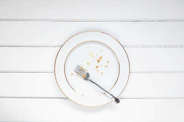 Dirty plate after a finished lemon cheesecake