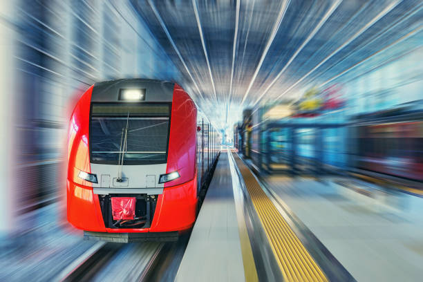 istock Passenger high speed train moves fast along the railway station platform. 1194701764