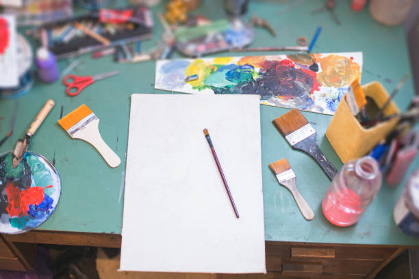 istock Messy table with painting equipment at the atelier 1194702330