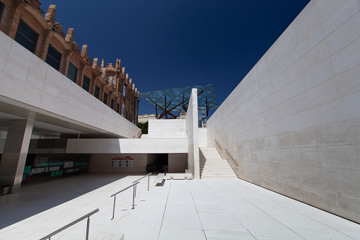 Barcelona, Spain - 22 June 2012: Modern minimalist architecture of CaixaForum contrasting with blue sky