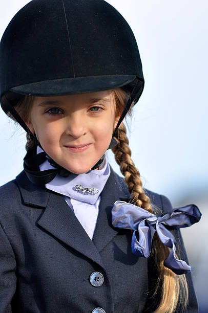 istock young girl in equestrian outfit 119470479