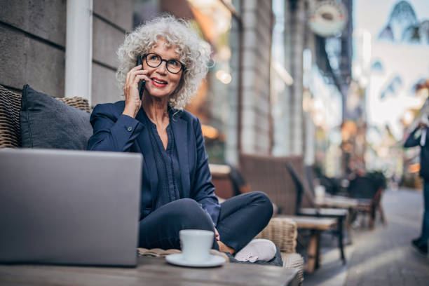 istock Beautiful senior woman in cafe 1194707631