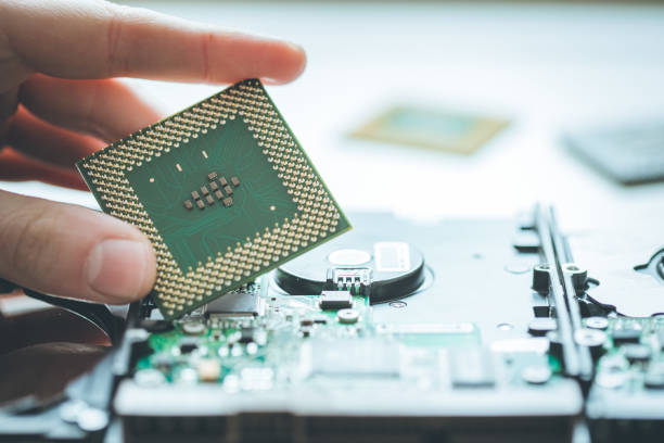 istock Computer Technology: Close up of male hands holding a cpu 1194708462