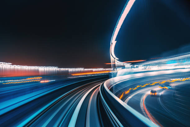 istock Futuristic High Speed Light Tail with Night City Background 1194708622