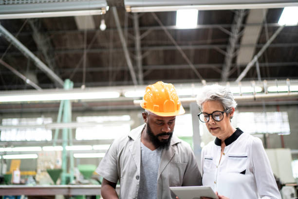 istock An engineer and a manager working together in a factory 1194708664
