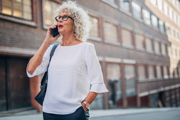 istock Senior woman using phone 1194708869