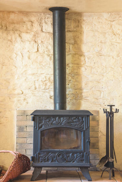 istock Cast iron wood burning stove with toools 1194709022