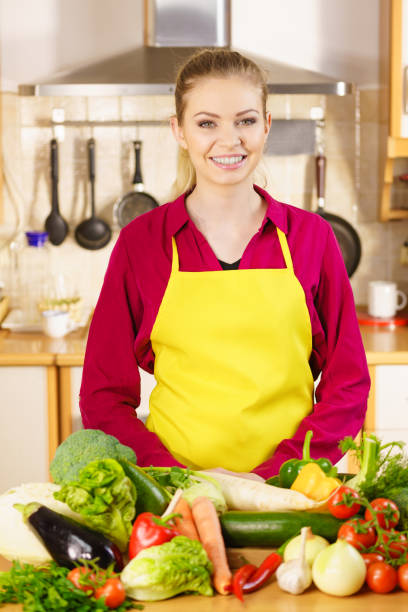 istock Woman in kitchen having many vegetables 1194709162