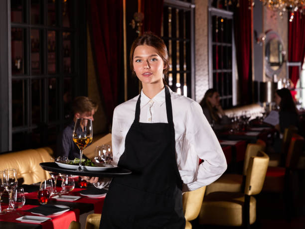 istock Portrait of smiling waitress 1194711198