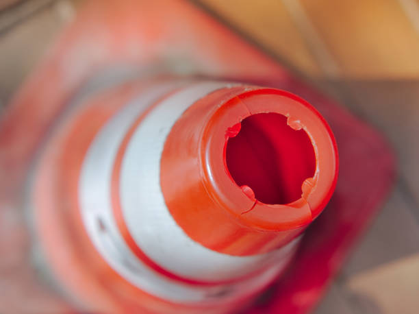 istock Selective focus of old striped red traffic cone. 1194711232