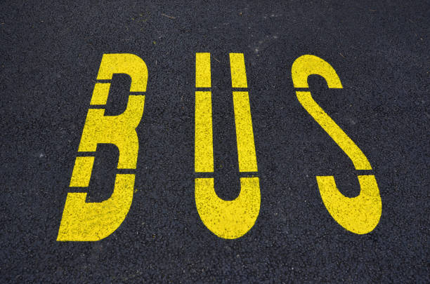 istock The yellow text Bus on the road 1194711331