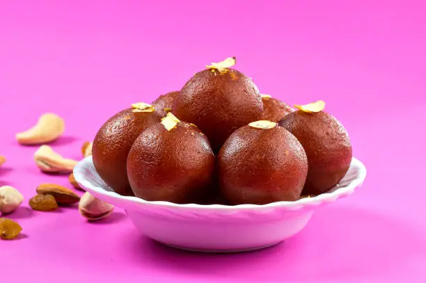 Photo of Indian Dessert : Gulab Jamun in white bowl