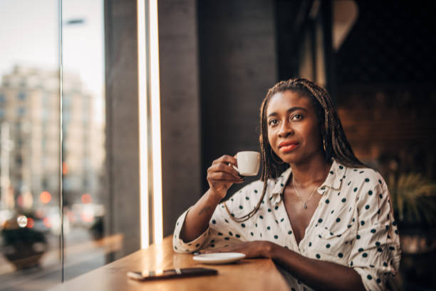 istock Woman drinking coffee at the cafe 1194711419