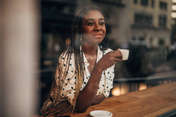 istock Woman drinking coffee at the cafe 1194711497