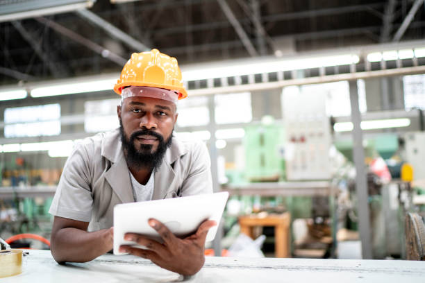 istock Man working with his digital tablet in the factory 1194713543