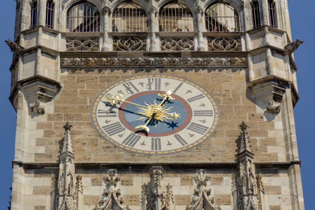 istock Low angle view of the facade clock on Munich Town Hall 1194713986