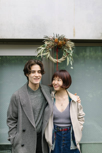 Couple standing under Shimekazari