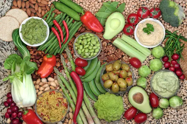 Vegan plant based food for an ethical healthy diet concept with foods high in omega 3, protein, vitamins, minerals, anthocyanins, antioxidants, smart carbs and dietary fibre. Flat lay.
