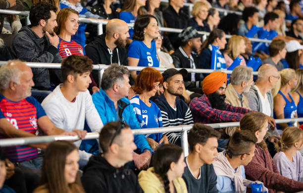 istock Smiling Crowd On Stadium Bleachers 1194717050
