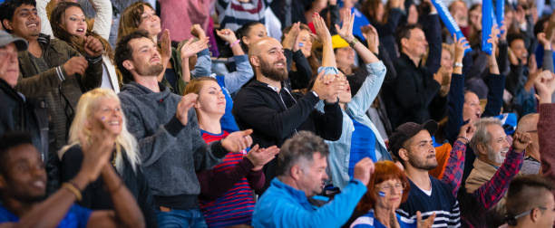 istock Smiling Crowd On Stadium Bleachers 1194717067