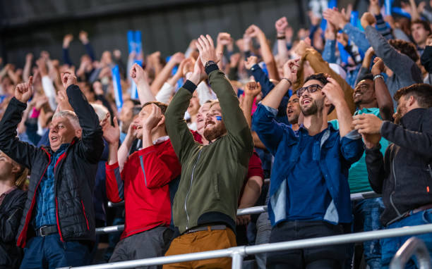 istock Smiling Crowd On Stadium Bleachers 1194717069
