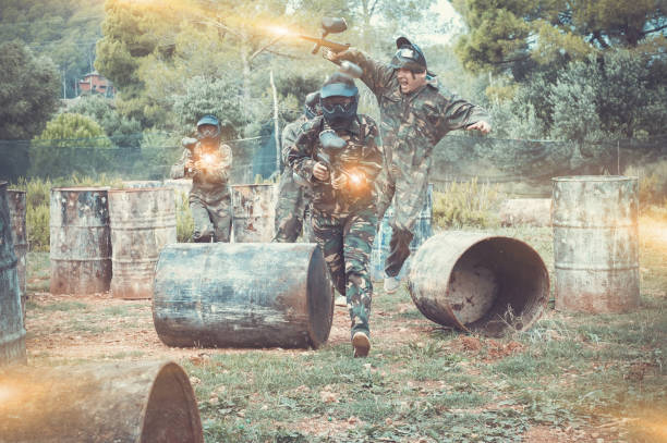 istock Group of people playing paintball 1194718428
