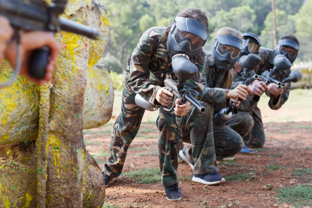 istock Paintball players aiming with gun 1194718441