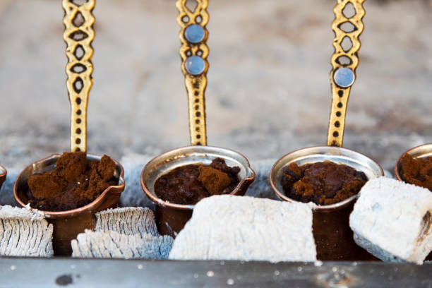 istock Traditional Turkish coffee cooked in hot sand and three copper cezve 1194719174