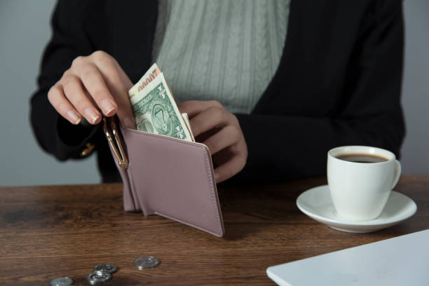 istock woman hand money with wallet 1194720800