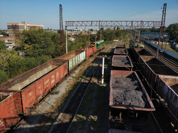 istock Railway. Freight wagons carrying different loads. Heavy industry concept 1194723635